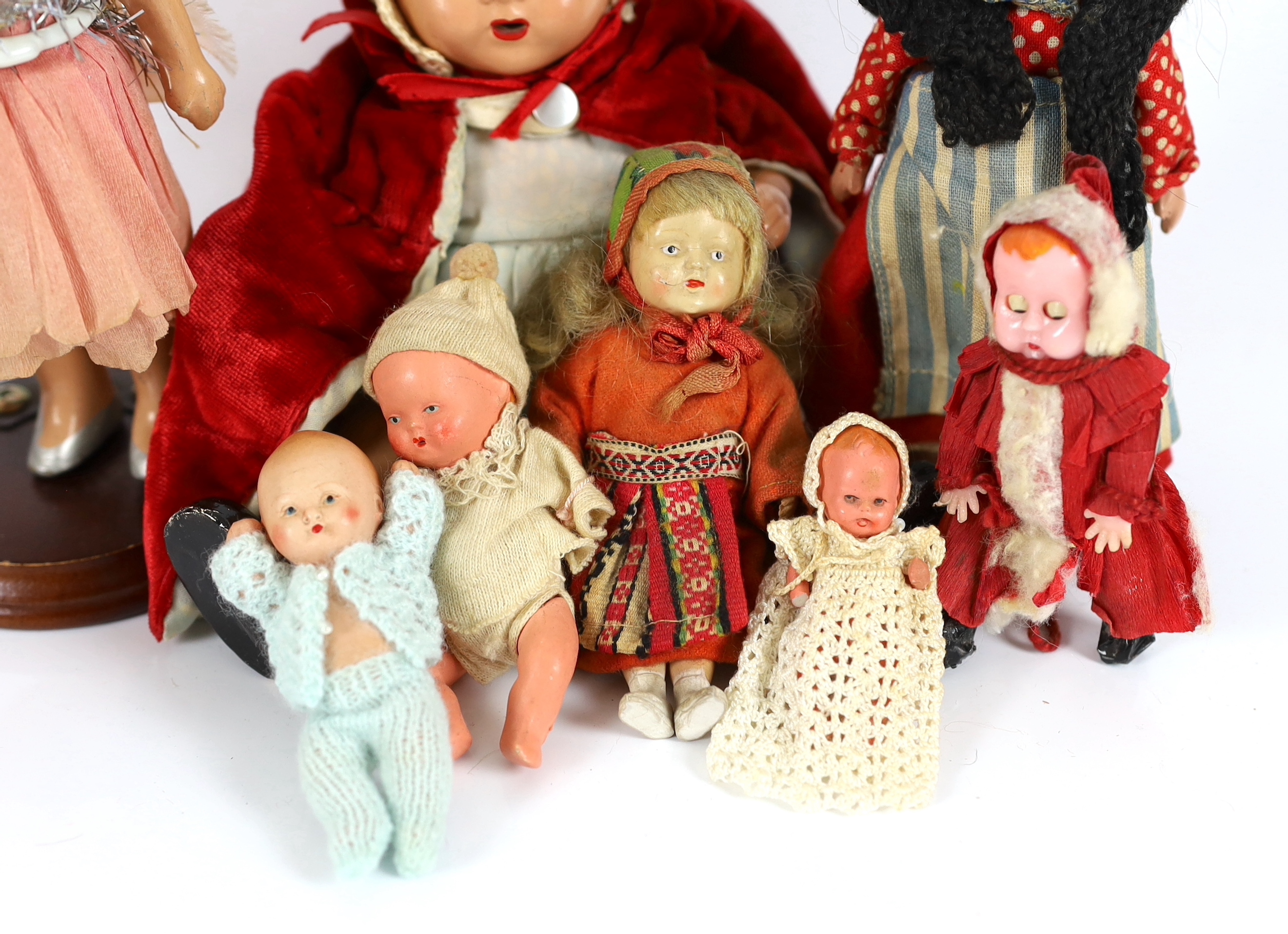 Nine assorted small dolls, mainly composition or plastic